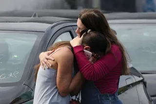Women embrace following a deadly collision between two helicopters in Rio de Janeiro, Brazil, June 14, 2026. REUTERS/Ricardo Moraes TPX IMAGES OF THE DAY