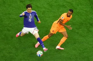 Japan’s Daichi Kamada in action with Netherlands’ Ryan Gravenberch.