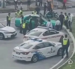 At least eight police vehicles were involved in pursuing a car carrying three men who allegedly fled from a police inspection along Jalan Tun Dr Ismail here today. - Viral pic