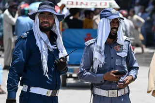 Police officers stand at a road junction in Rawalpindi, Pakistan, on Tuesday. Photo: AFP