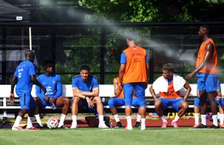 France's William Saliba, Ngolo Kante, Ibrahima Konate and Desire Doue take a seat during training.
