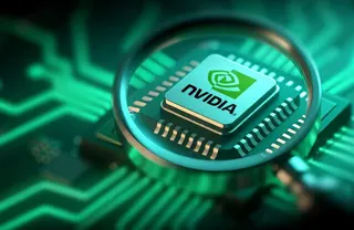 Photo illustration in which an Nvidia chip is seen through a magnifying glass
