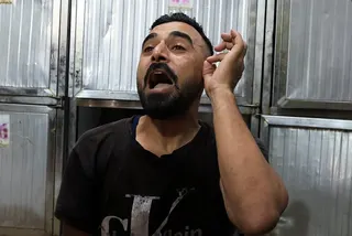 A Palestinian man mourns victims of an Israeli strike at Al-Shifa Hospital in Gaza City on Sunday. Photo: Reuters