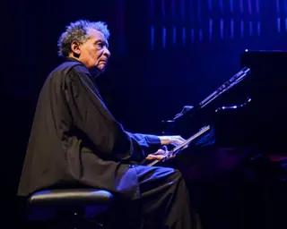 a man plays piano