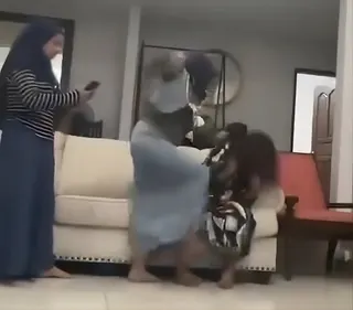 One of the two sisters is seen striking the Indonesian helper in this still from the video. Photo: Threads