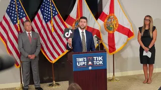 Florida Attorney General James Uthmeier speaking at a podium