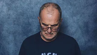 Marcelo Bielsa looks down at a World Cup promo photoshoot