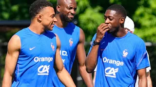France's Kylian Mbappé and France's Ousmane Dembélé talk during a training session during the FIFA World Cup soccer
