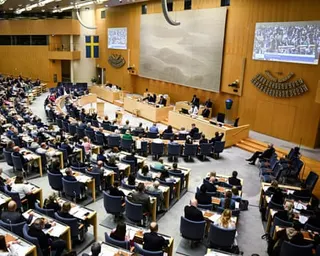 Members of the Swedish parliament vote on immigration legislation