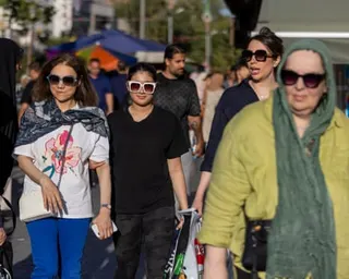People are seen out in the street in Tehran