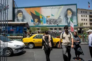 People walk along Enghelab Square in the downtown part of the Iranian capital of Tehran.