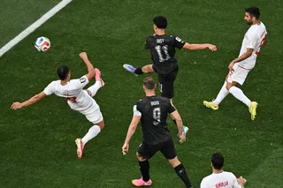 New Zealand’s Elijah Just scores his side’s opening goal against Iran at the World Cup. Photo: dpa