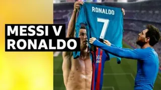 Cristiano Ronaldo and Lionel Messi holding their shirts up