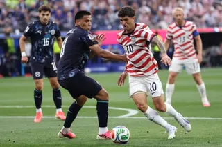 Christian Pulisic of USA battles for the ball with Diego Gomez of Paraguay during the FIFA World Cup 2026 Group D match between USA and Paraguay at Los Angeles Stadium on June 12, 2026 in Los Angeles, California.