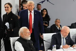 US President Donald Trump arrives as India's Prime Minister Narendra Modi (L) and Brazil's President Luiz Inacio Lula da Silva (R) attend a morning work meeting to “revive balanced, inclusive, and sustainable economic growth for the benefit of all” in the presence of the G7 countries, partner countries, the International Monetary Fund, and the OECD, as part of the G7 summit, in Evian, eastern France, on June 17, 2026.