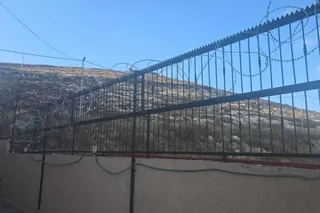 Following the attack, Faqih was forced to fortify his dream home with heavy barbed wire and metal guards, transforming it into what he describes as a "real prison."