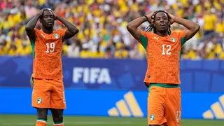 Ivory Coast's Elye Wahi and Nicolas Pepe reacting after missing a scoring chance in a soccer match.