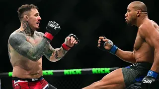 Ciryl Gane delivers a low kick to Tom Aspinall during their bout in UFC 321 in Abu Dhabi