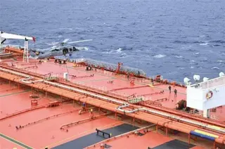 US Department of Defense An image showing a helicopter landing on the deck of an oil tanker