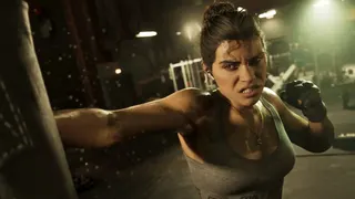 Lucia punches a punchbag with an angry expression.