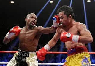 Floyd Mayweather Jr and Manny Pacquiao in action.