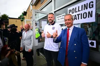 Reform UK candidate Rob Kenyon, wearing an England football shirt as he casts his vote in the Makerfield by-election at St Aidan’s Parish Centre