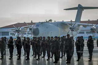 The  Royal Malaysian Air Force personnel salute and present arms during the 68th RMAF Anniversary parade at Subang Air Base. – NSTP/Asyraf Hamzah