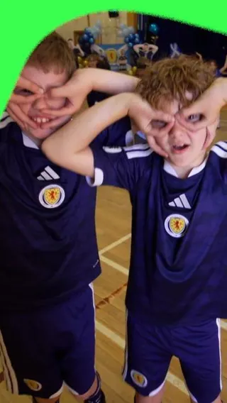 Children do John McGinn's celebration at his old school