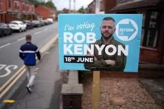 A Reform UK placard of their byelection candidate Robert Kenyon stands outside a home on June 03, 2026 in Ashton-in-Makerfield, England.