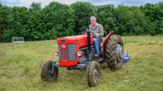 Jeremy Clarkson is seen riding a tractor