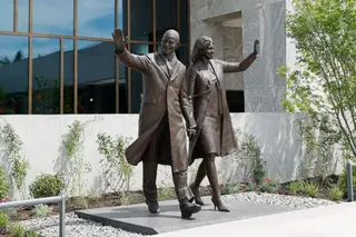AFP via Getty Images A bronze statue outside the building depicts Barack and Michelle Obama waving.