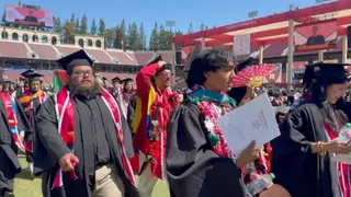 Students are seen walking out of the commencement ceremony.