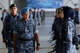 RMAF chief General Tan Sri Muhamad Norazlan Aris inspects the parade during the RMAF’s 68th anniversary celebration at Subang Air Base.-NSTP/Asyraf Hamzah.
