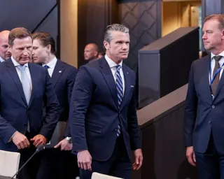 Man walks past other men