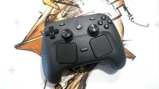 A Steam Controller sits on a white mousepad.