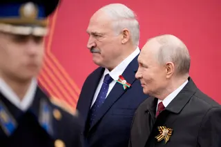 Belarusian President Alexander Lukashenko (centre) and Russian President Vladimir Putin attend the Victory Day military parade in Moscow in May. Photo: Reuters