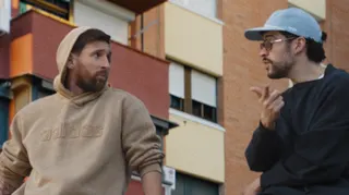 Lionel Messi and musician Bad Bunny are sitting on a car roof