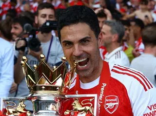 Soccer Football - Premier League - Crystal Palace v Arsenal - Selhurst Park, London, Britain - May 24, 2026 Arsenal manager Mikel Arteta celebrates with the trophy after winning the Premier League Action Images via Reuters/Matthew Childs EDITORIAL USE ONLY. NO USE WITH UNAUTHORIZED AUDIO, VIDEO, DATA, FIXTURE LISTS, CLUB/LEAGUE LOGOS OR 'LIVE' SERVICES. ONLINE IN-MATCH USE LIMITED TO 120 IMAGES, NO VIDEO EMULATION. NO USE IN BETTING, GAMES OR SINGLE CLUB/LEAGUE/PLAYER PUBLICATIONS. PLEASE CONTAC