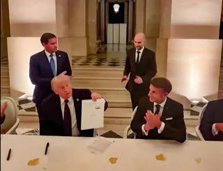 This videograb from footage made available on June 18, 2026, from the X account of French President Emmanuel Macron shows (from left) US President Donald Trump and France’s President Emmanuel Macron during the signing of a deal with Iran to end the Middle East war, inside Chateau de Versailles, in Versailles June 17, 2026. — Picture via X/@EmmanuelMacron/AFP