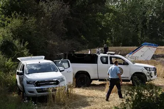 Forensic technicians on Saturday examine the wreckage of the Cessna 421 that crashed the previous day in La Baule, western France. Photo: AP