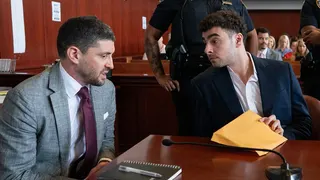 Luigi Mangione standing in a courtroom in Manhattan Criminal Court in New York City