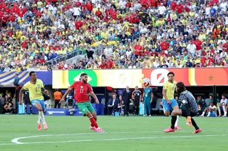 Ismael Saibari (in red) calmly scores for Morocco in their 1-1 group draw against Brazil.