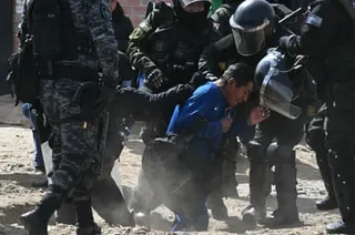 A man is arrested at a blockade zone in Cruce Ventilla in El Alto on Saturday