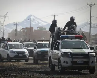 Security forces patrol a road in La Paz, Bolivia, on Saturday after the government declared a state of emergency and deployed bulldozers to clear blockades