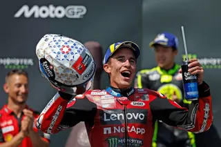 Marc Marquez celebrates on the podium