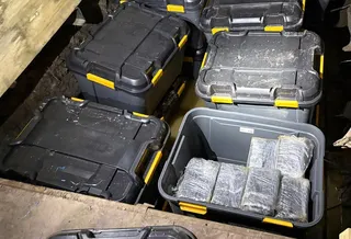 Cocaine is hidden in plastic tubs buried underground on the outskirts of Sydney. Photo: Australian Federal Police/AFP