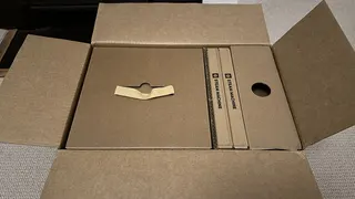 Photograph of the Steam Machine boxes as they arrive for shipping, outer box only opened, from front angle