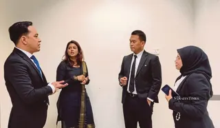 Handwriting expert Dr Linthini Gannetion (second from left) told coroner Amir Shah Amir Hassan that there are four stages in the development of a person's handwriting. - NSTP pic