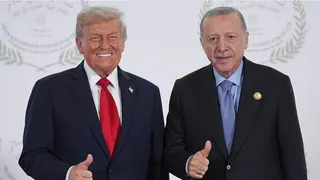 President Donald Trump greeting Turkey's President Recep Tayyip Erdogan at a summit in Sharm El Sheikh Egypt