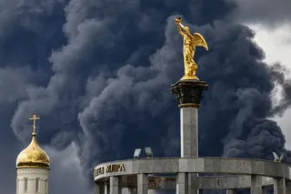 Smoke billows behind an Orthodox church following a reported Ukrainian drone attack, in Moscow, Russia, on Thursday. Photo: EPA
